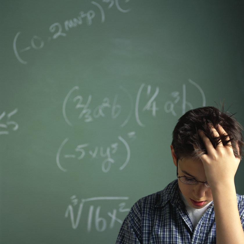 Schoolboy Struggling with Math Problems